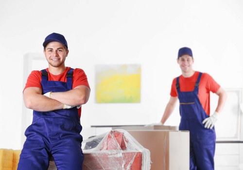 Removal team handling packed boxes during a house move
