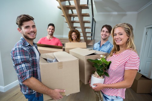 Moving boxes and furniture prepared for a home move in Westkensington