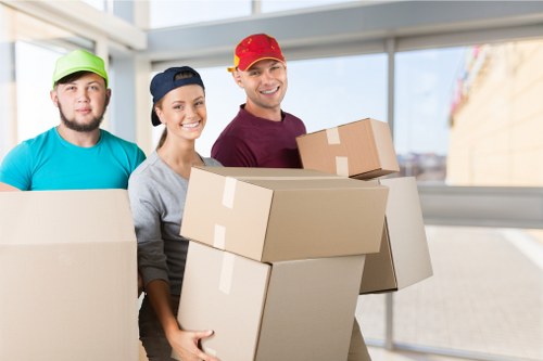 Removal team handling boxes safely during a planned move