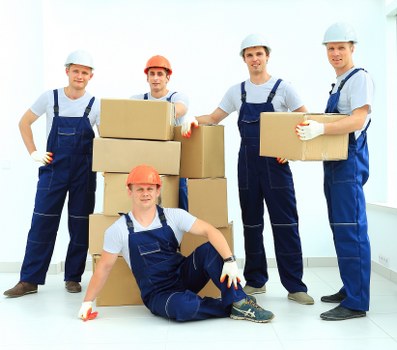 Movers loading furniture for an urgent relocation in Westkensington