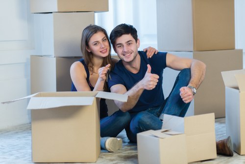 Professional movers loading boxes into a van