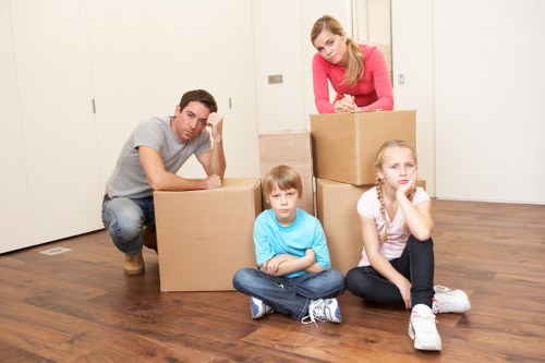 Professional movers handling furniture during a West Kensington relocation