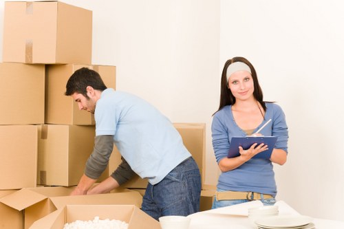 Professional movers loading household items carefully