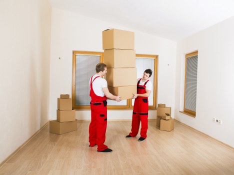 Apartment moving preparation for West Kensington flat removals with labeled boxes
